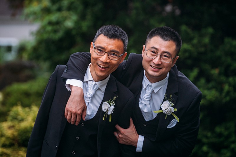 lgbt grooms laughing